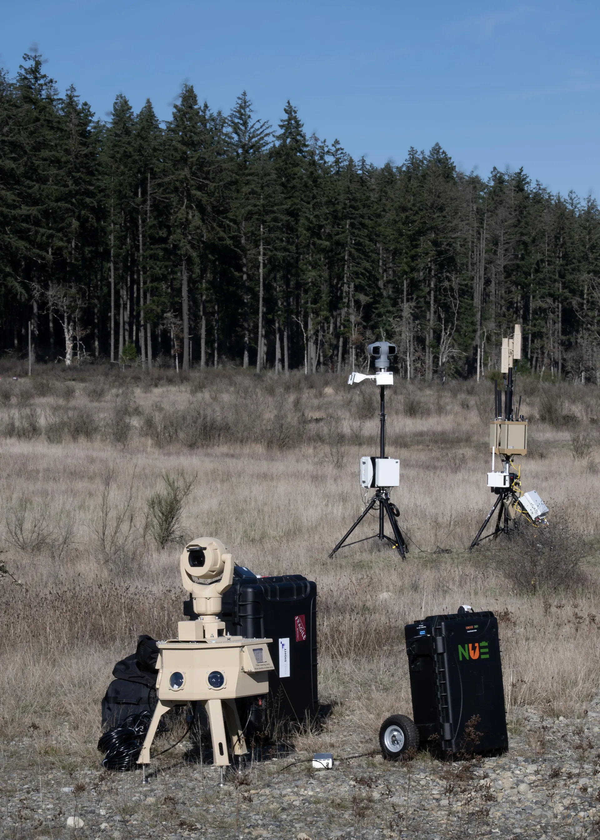 C-UAS sensor array and ISR turret deployed in field, wide view