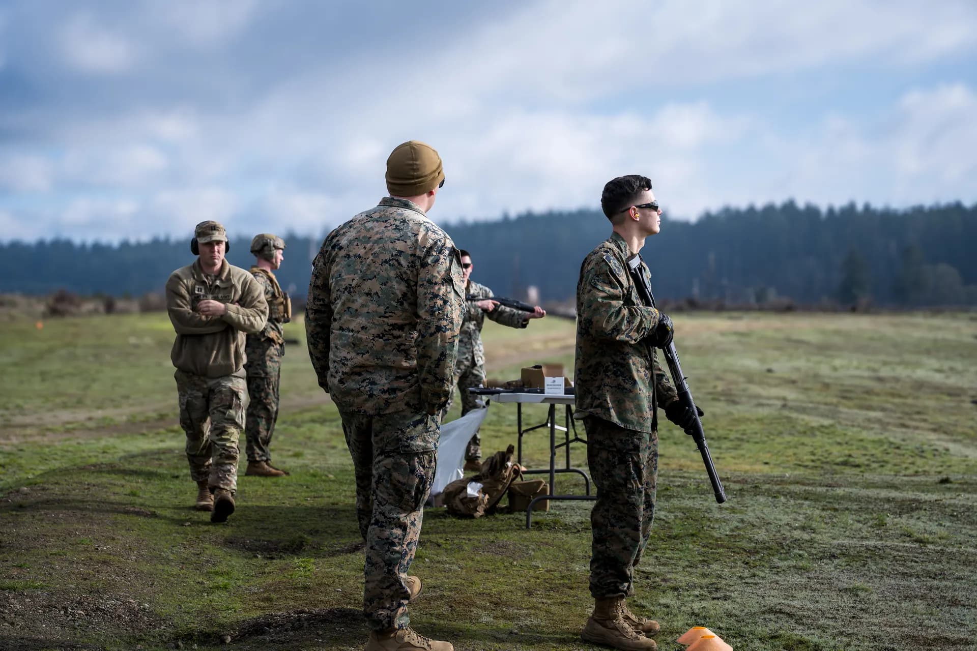 Marines staged at live fire range with shotguns